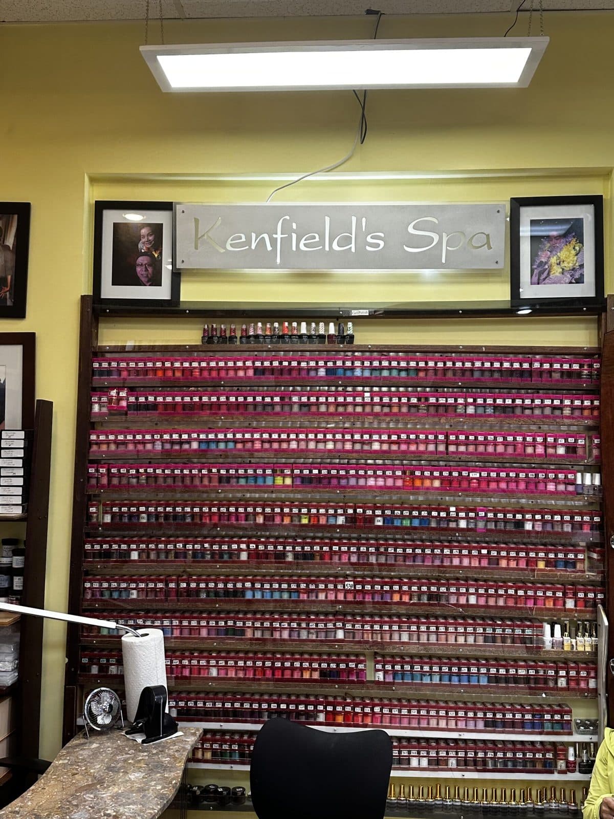 The nail polish wall under the Kenfield's Spa sign