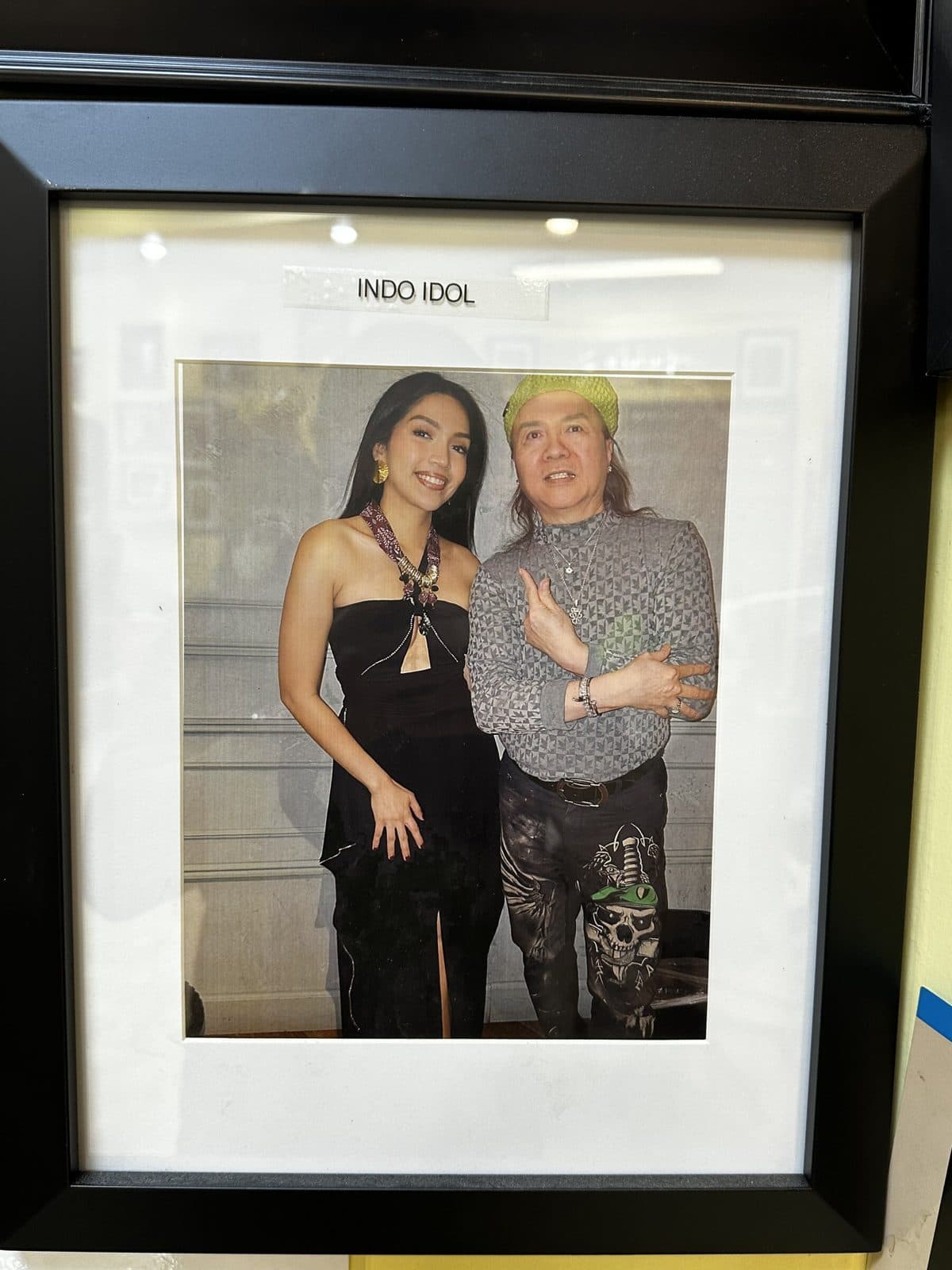 Framed photo on the salon wall, labeled Indo Idol