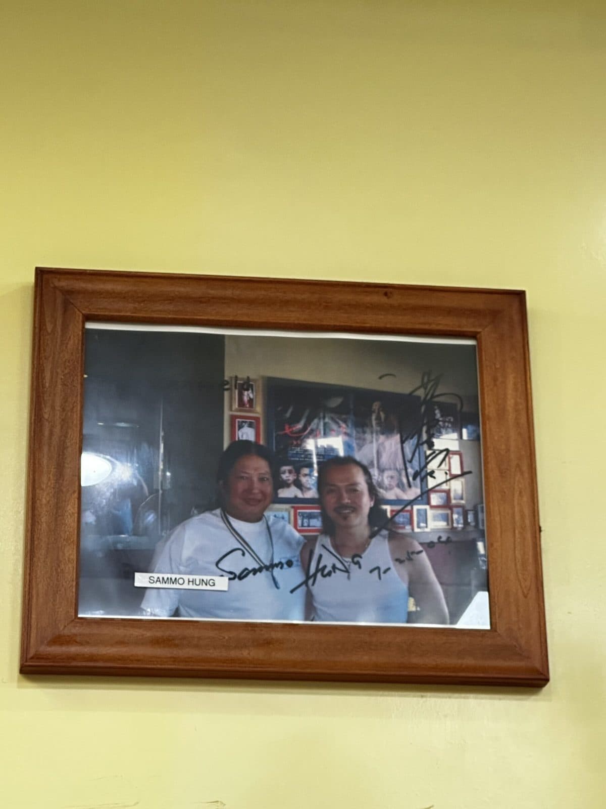 Signed photo in a wooden frame, labeled Sammo Hung